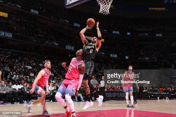Jayson Tatum of the Boston Celtics drives to the basket during the game against the Washington Wizards on March 28, 2023 at Capital One Arena in...