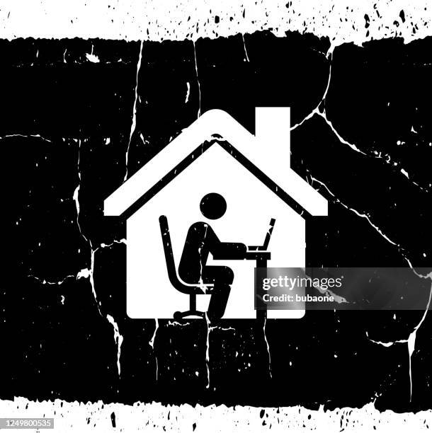 man working on a laptop icon - man using computer at home stock illustrations