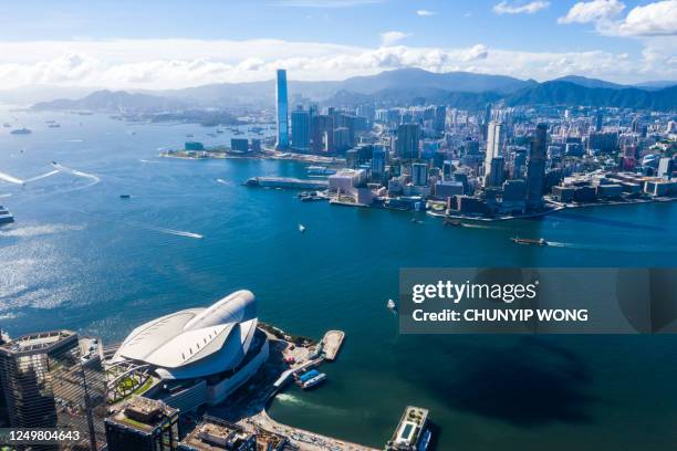 drone view of hong kong city - hong kong convention and exhibition centre stock pictures, royalty-free photos & images