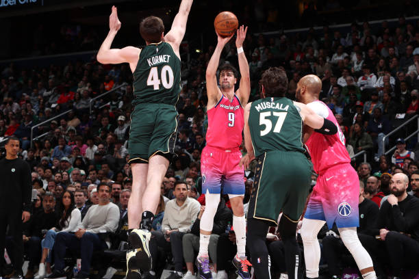 Deni Avdija of the Washington Wizards shoots a three point basket during the game against the Boston Celtics on March 28, 2023 at Capital One Arena...