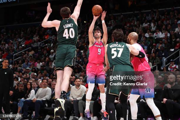 Deni Avdija of the Washington Wizards shoots a three point basket during the game against the Boston Celtics on March 28, 2023 at Capital One Arena...