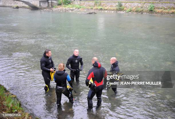 Divers listens to the last instructions during a drill by the Gave river on September 11, 2008 in Lourdes ahead of the visit of Pope Benedict XVI who...