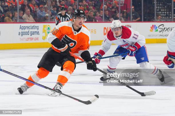 Morgan Frost of the Philadelphia Flyers controls the puck against Brendan Gallagher of the Montreal Canadiens in the second period at the Wells Fargo...
