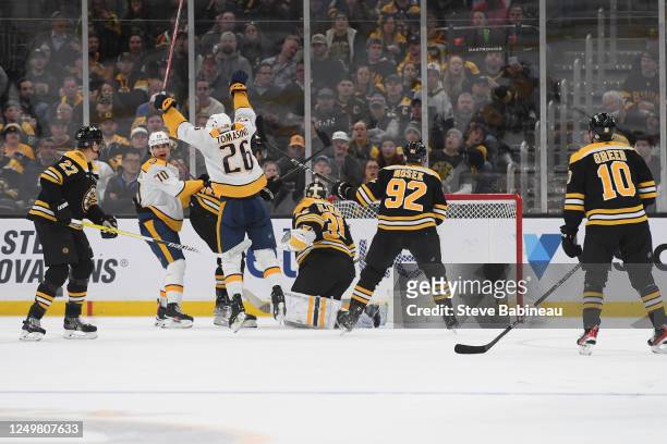 Egor Afanasyev and Philip Tomasino of the Nashville Predators celebrate a second period goal against the Boston Bruins at the TD Garden on March 28,...