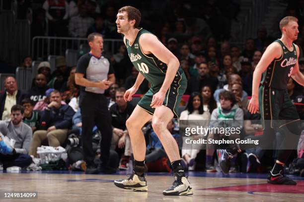 Luke Kornet of the Boston Celtics plays defense during the game against the Washington Wizards on March 28, 2023 at Capital One Arena in Washington,...