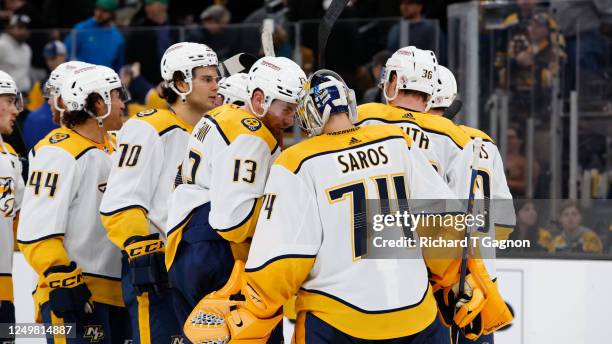 Juuse Saros of the Nashville Predators celebrates a 2-1 win against the Boston Bruins with his teammates at the TD Garden on March 28, 2023 in...