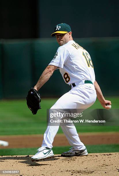 Rich Harden of the Oakland Athletics pitches against the Los Angeles Angels of Anaheim during an MLB baseball game at O.co Coliseum on September 14,...