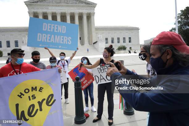 Advocates for immigrants with Deferred Action for Childhood Arrivals, or DACA, rally in front of the U.S. Supreme Court June 15, 2020 in Washington,...