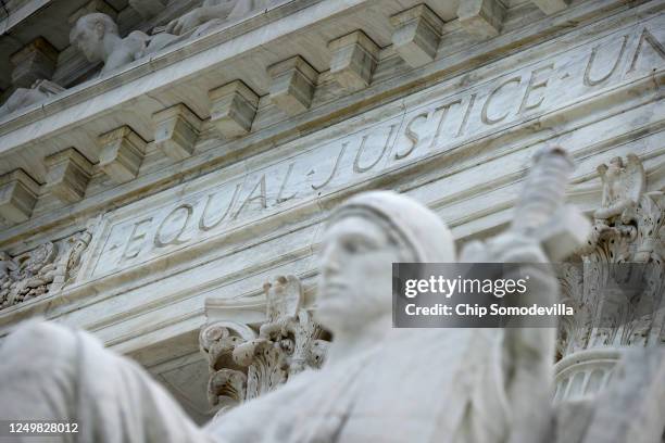 The statue Authority of Law by sculptor James Earle Fraser stands on the steps of the U.S. Supreme Court which ruled that LGBTQ people can not be...