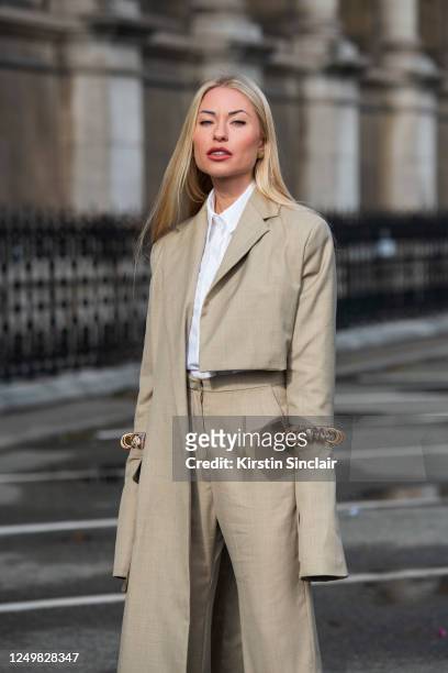 Digital influencer and model Lexi Fargo wears a Maison Bent suit and shirt on February 29, 2020 in Paris, France.