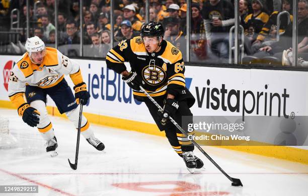 Brad Marchand of the Boston Bruins skates with the puck in the third period against the Nashville Predators at TD Garden on March 28, 2023 in Boston,...