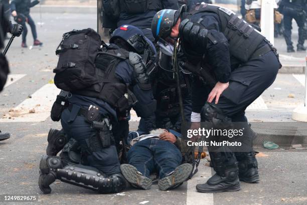 Riot police officers are coming to the rescue of a protester who was knocked unconscious on the ground after a violent police charge, as clashes...