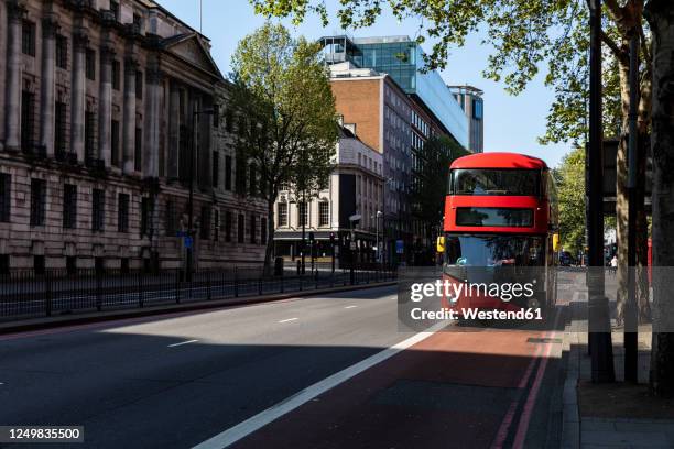 uk, london, red double decker bus on street near euston station - bus road stock pictures, royalty-free photos & images