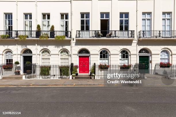 uk, london, white building red and black doors in empty street  during curfew - bloomsbury london stock pictures, royalty-free photos & images