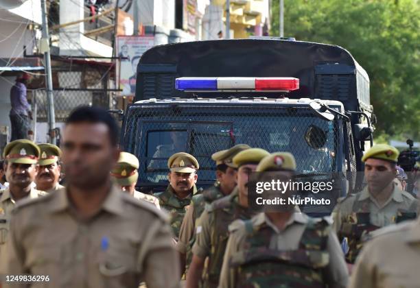 Atiq Ahmad is taken to prison by police after being convicted in session court , for Umesh Pal Kidnapping case , in Allahabad on March 28, 2023.