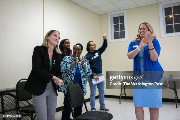 Anderson Clayton, the new 25-year-old NC Democratic Party chair, is applauded by members of the Union County Democratic Party at an organizing event...