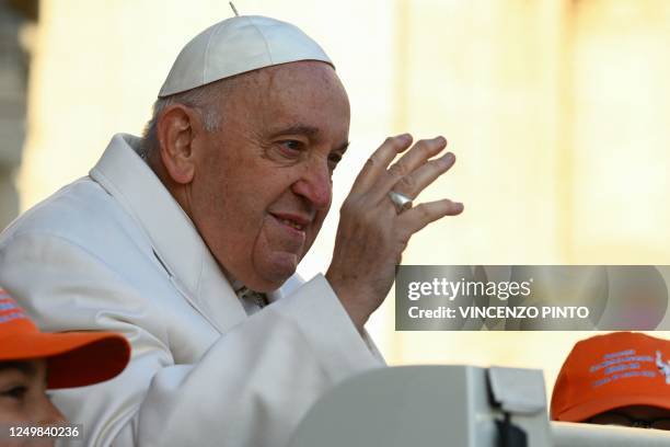 Pope Francis waves from the popemobile car as he arrives at St. Peter's square on March 29, 2023 in The Vatican to hold the weekly general audience.