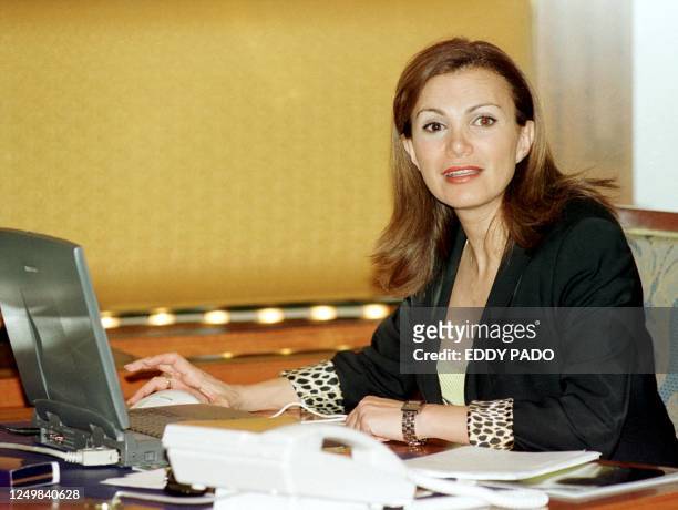 Lebanese Broadcast Corporation International television show host Giselle Khoury sits at her desk 02 May 2001 during a visit to Dubai. Khoury, who...