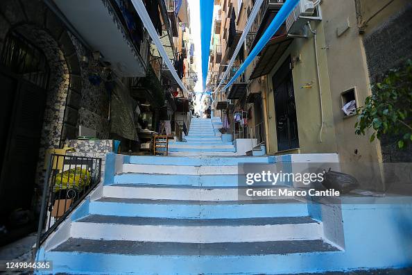 A staircase completely painted blue in an alley in the...