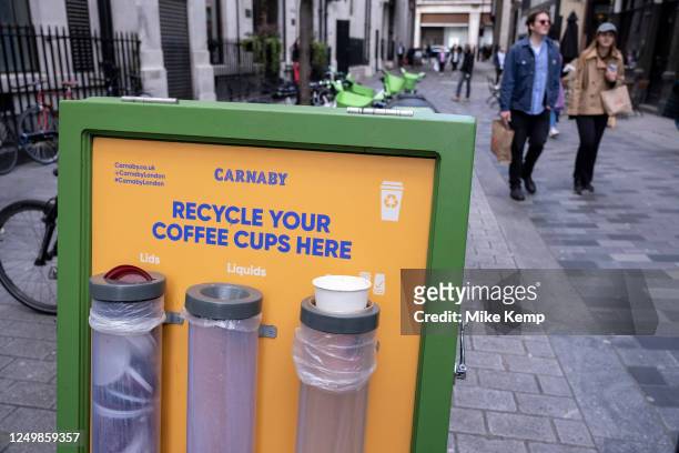 Recycling station for used coffee cups near Carnaby Street on 27th March 2023 in London, United Kingdom.