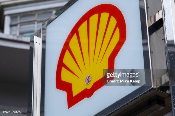 Extinction Rebellion sticker on a Shell Oil Company logo on 26th March 2023 in London, United Kingdom. Shell Oil Company is the United States-based...