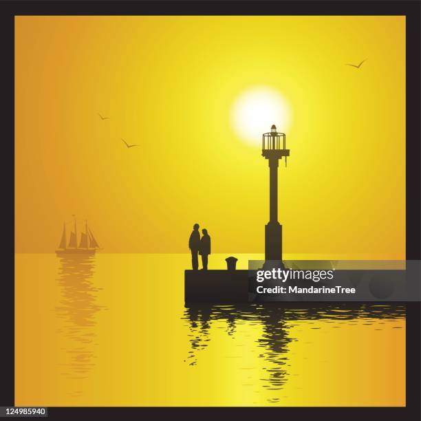 lighthouse at sunset - jetty stock illustrations