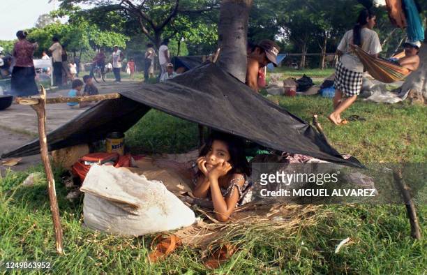 Young girl is seen under a make-shift tent in Manague, Nicaragua. Hundreds of people have migrated here from their rural parts of the country due to...