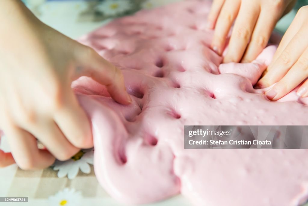 Child plays with a slime