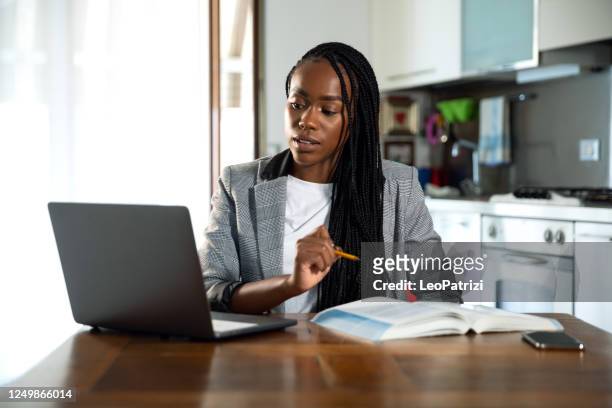 woman learning and teaching homeschooling in video conference - adult student stock pictures, royalty-free photos & images