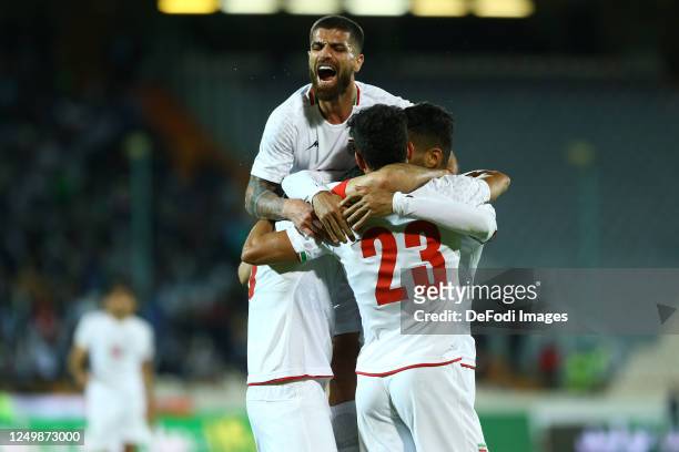 Ramin Rezaeian of Iran celebrates after scoring his teams second goal with team mates Milad Sarlak of Iran during the international Friendly match...