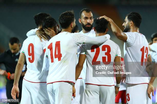 Ramin Rezaeian of Iran celebrates after scoring his teams second goal with team mates Roozbeh Cheshmi of Iran during the international Friendly match...