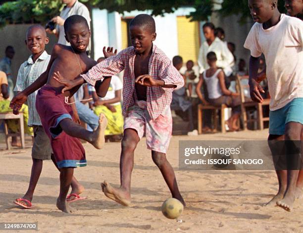 Young Ivorians play a soccer match, 03 September 2000, in Youpougon, an underprivileged neighborhood of Abidjan. Each neighborhood of Abidjan...