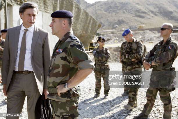 France Televisions head Patrick de Carolis talks to admiral Xavier Baitard, France's Defence Minister Herve Morin chief cabinet, on June 22, 2010 in...