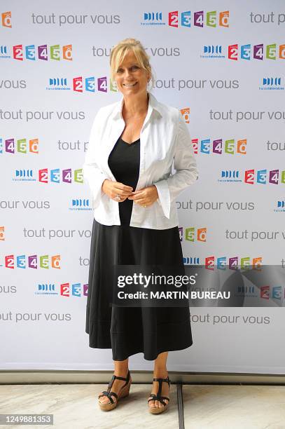 French TV host of the public media group France Television, Catherine Matausch poses during a press conference announcing the 2009/2010 TV programs,...