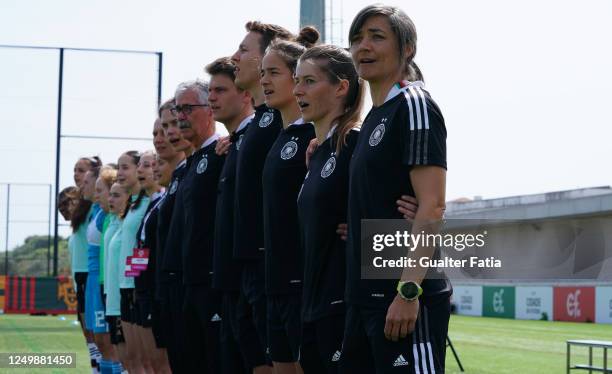 Sabine Loderer of Germany with staff members and players during the National Anthem before the start of the UEFA Women's Under-17 Championship...