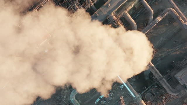 Aerial view. Pipes Throwing Smoke in the Sky