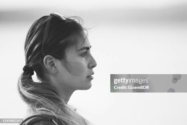 black and white portrait of sad woman outdoors - black and white hair imagens e fotografias de stock