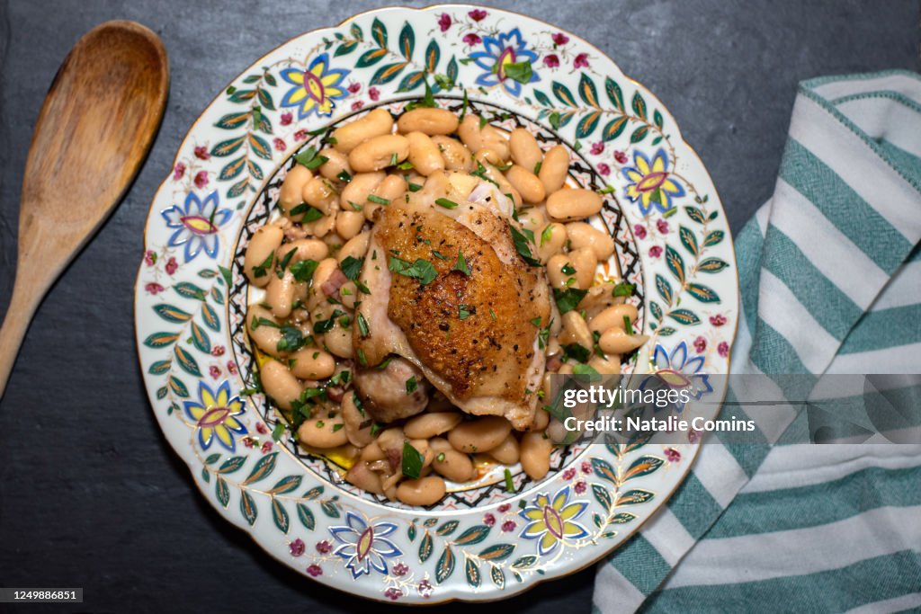 Chicken thighs with white beans, rosemary and pancetta