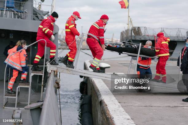 Romanian paramedics take part in a refugee evacuation exercise onboard the 'Alexandru Catuneanu' marine hydrographic vessel, as part of the...