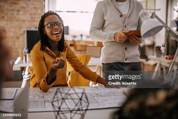 black woman with surprised emotion at office - creative director stock pictures, royalty-free photos & images