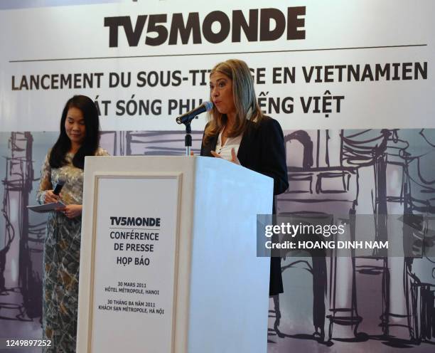 Marie-Christine Saragosse, CEO of France's TV5 Monde, addresses a press conference on the launching of the channel subtitled in Vietnamese in Hanoi...