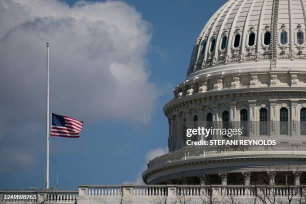 The US flag flies at half mast outside the US Capitol in Washington, DC, on March 29, 2023. - A heavily armed former student killed three young...