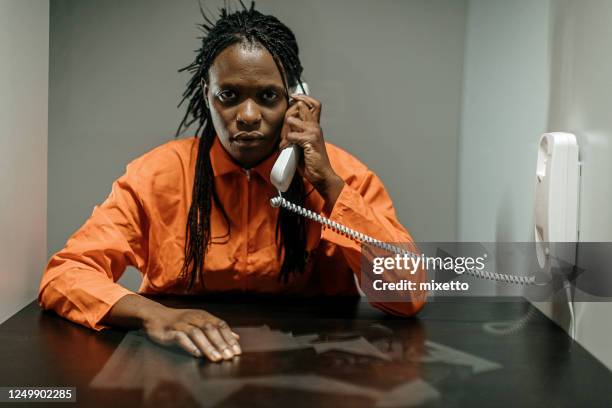 it is my right not to say anything - woman in prison uniform stock pictures, royalty-free photos & images