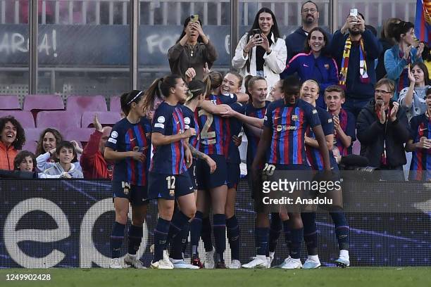Players of Barcelona celebrate after scoring a goal during the UEFA Women's Champions League Quarter-Final second leg football match between FC...