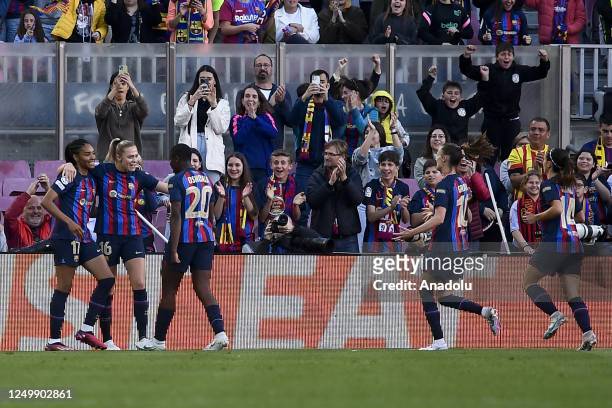 Players of Barcelona celebrate after scoring a goal during the UEFA Women's Champions League Quarter-Final second leg football match between FC...