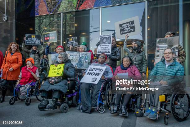 Participants holding signs demanding subway accessibility. The Rise and Resist Elevator Action Group, coalition partners and elected officials will...