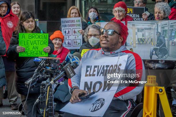 Participant holding a sign demanding subway accessibility. The Rise and Resist Elevator Action Group, coalition partners and elected officials will...
