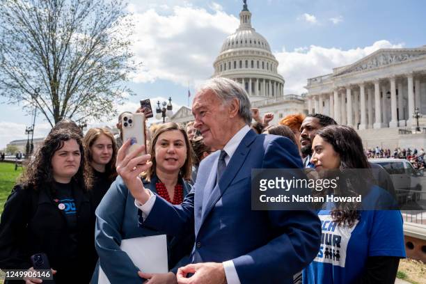 Sen. Edward Markey and Rep. Elissa Slotkin take a selfie with firearm safety advocates during a press conference at the U.S. Capitol on March 29,...