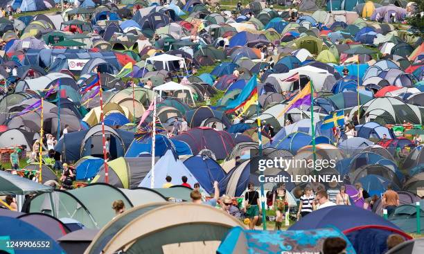 Tents start to fill the camp sites on the first day of the annual Glastonbury festival near Glastonbury, Somerset, on June 24, 2009. Veteran rockers...