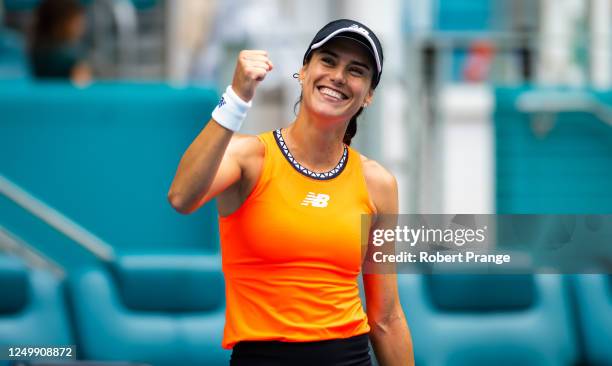 Sorana Cirstea of Romania celebrates defeating Aryna Sabalenka in her quarter-final match on Day 11 of the Miami Open at Hard Rock Stadium on March...